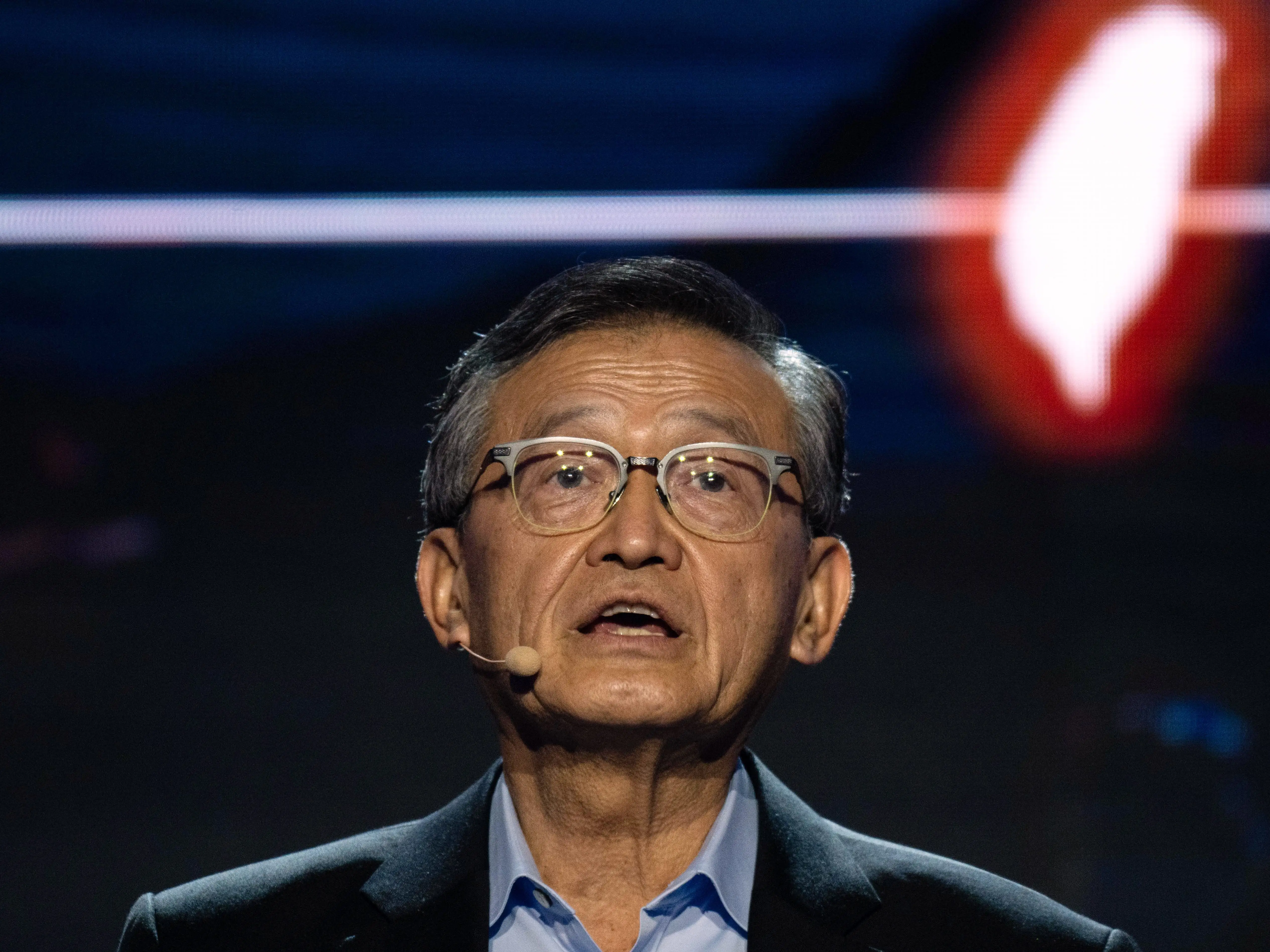 Lip-Bu Tan speaks at Computex 2026 in Taipei, Taiwan, looking up and wearing glasses.