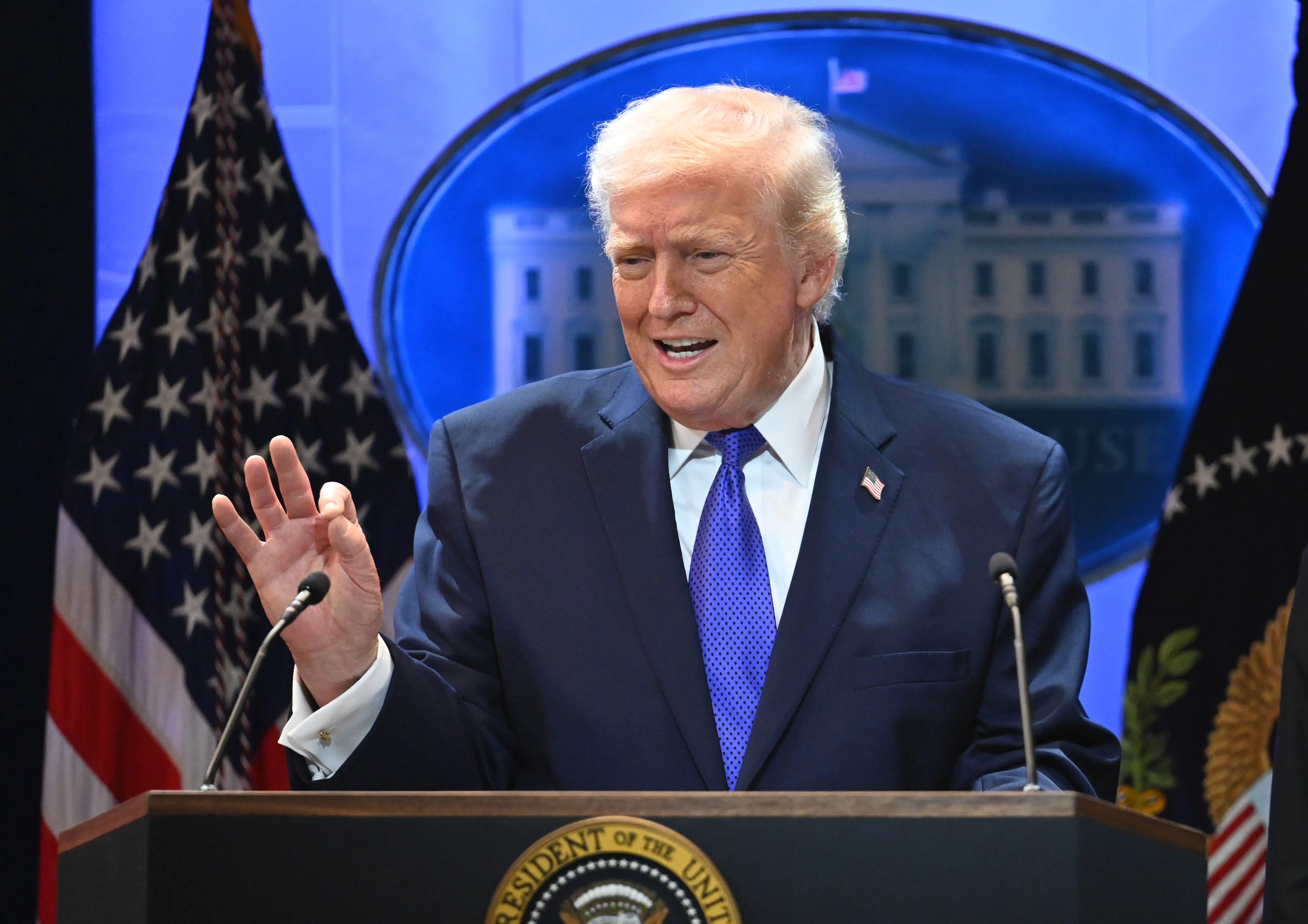 President Donald Trump speaks during a press briefing at the White House.