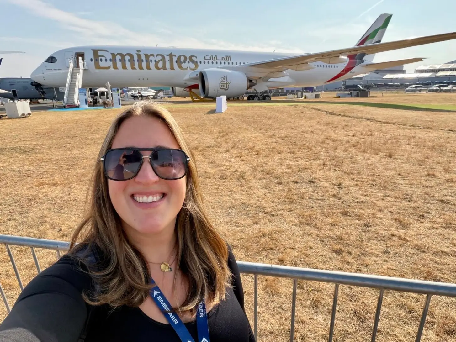 The author takes a selfie in front of an Emirates Airbus A350-900 on display at the 2026 Farnborough Airshow