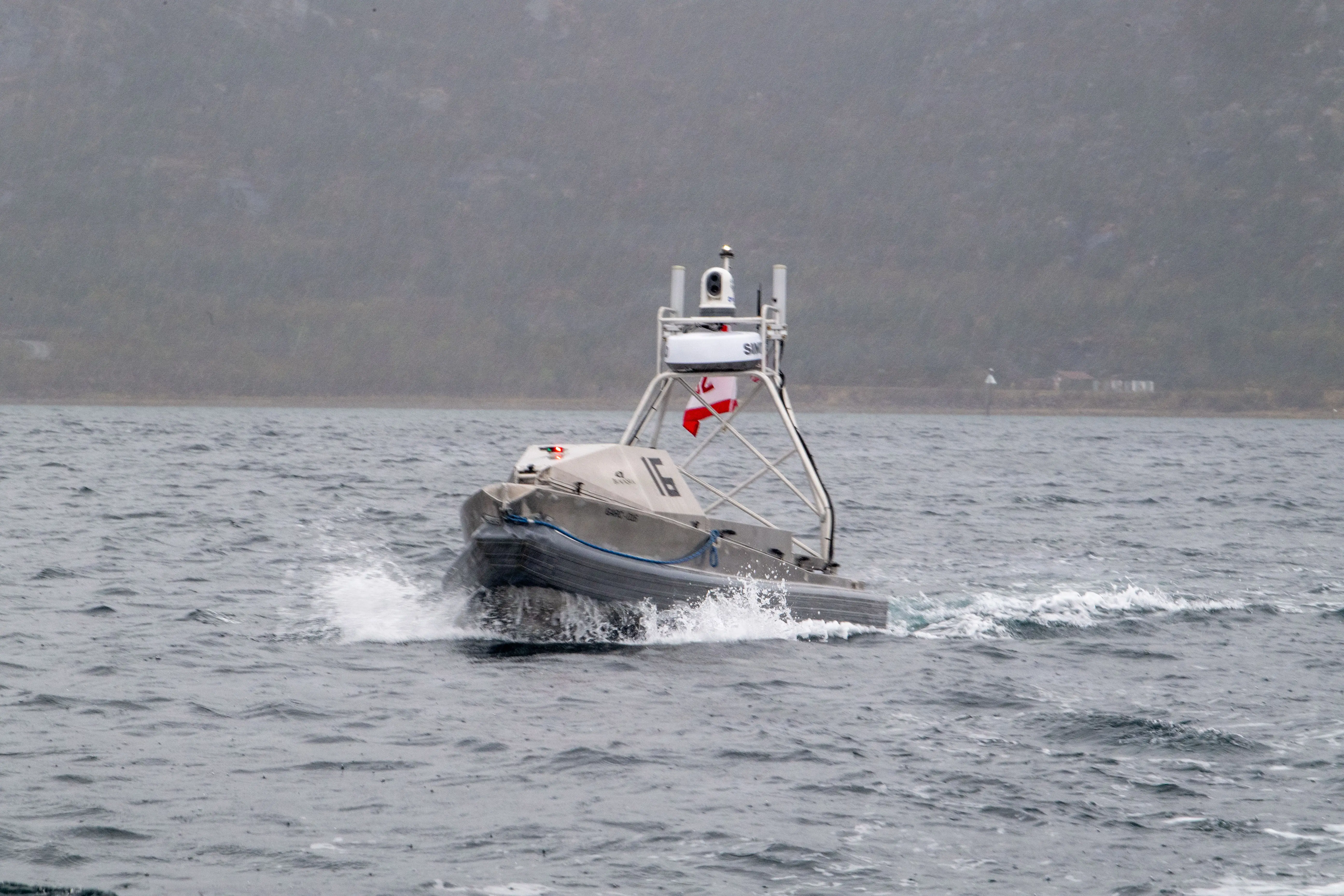 A Global Autonomous Reconnaissance Craft, attached to Commander, Task Force (CTF) 66, operates in Breivika Bay during Arctic Sentry 2026.
