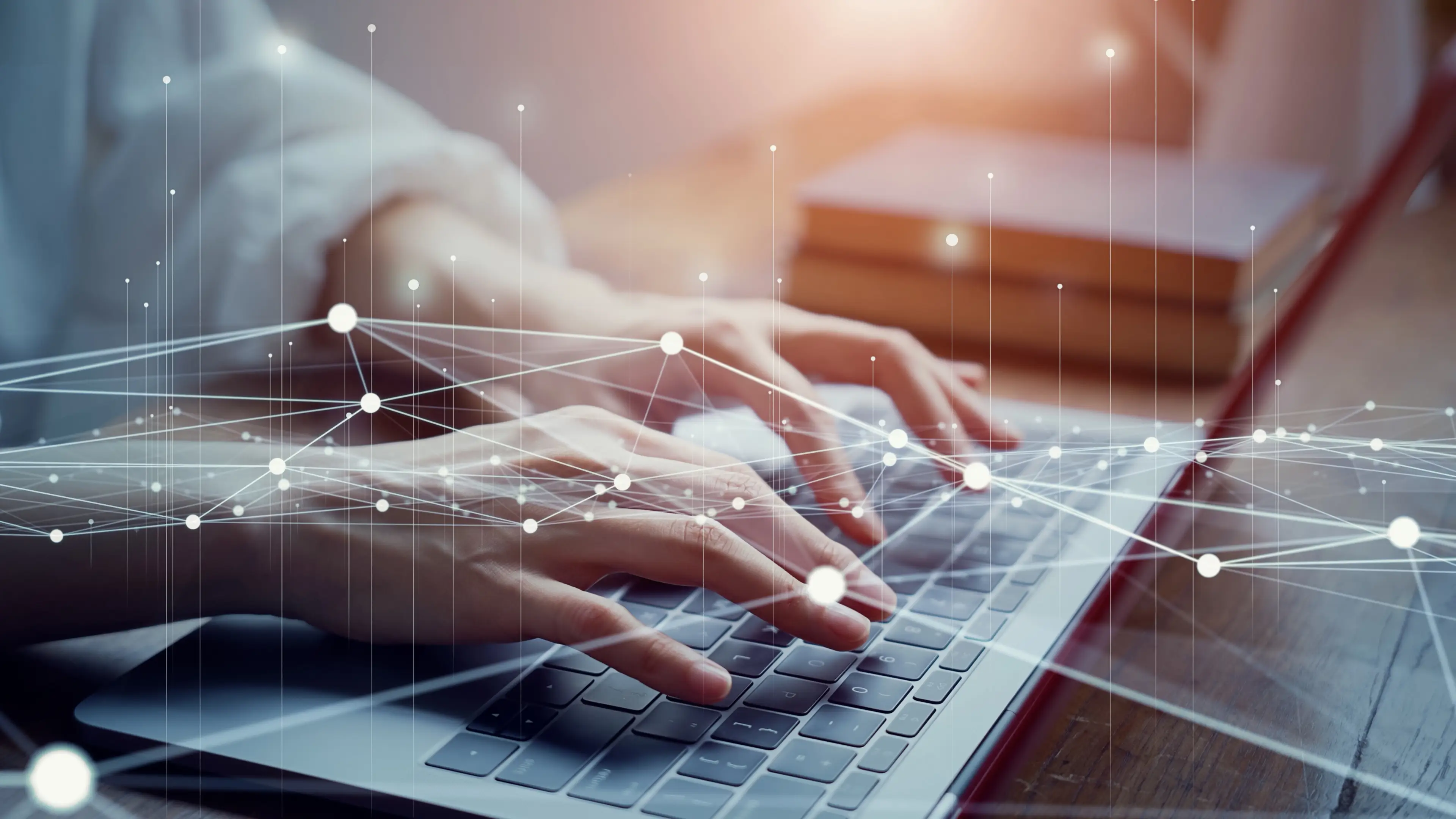 Hands on a laptop.