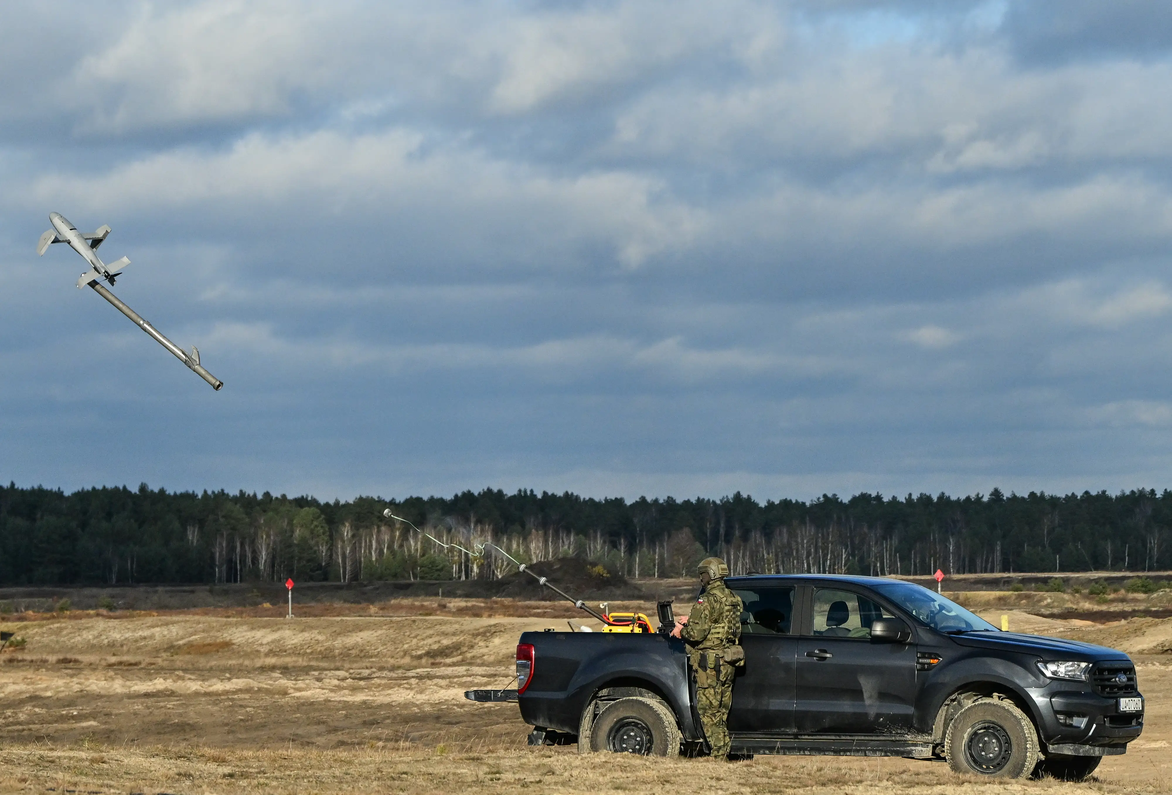 A Polish Army soldier launches an AS3 Surveyor interceptor drone, part of the Merops system.