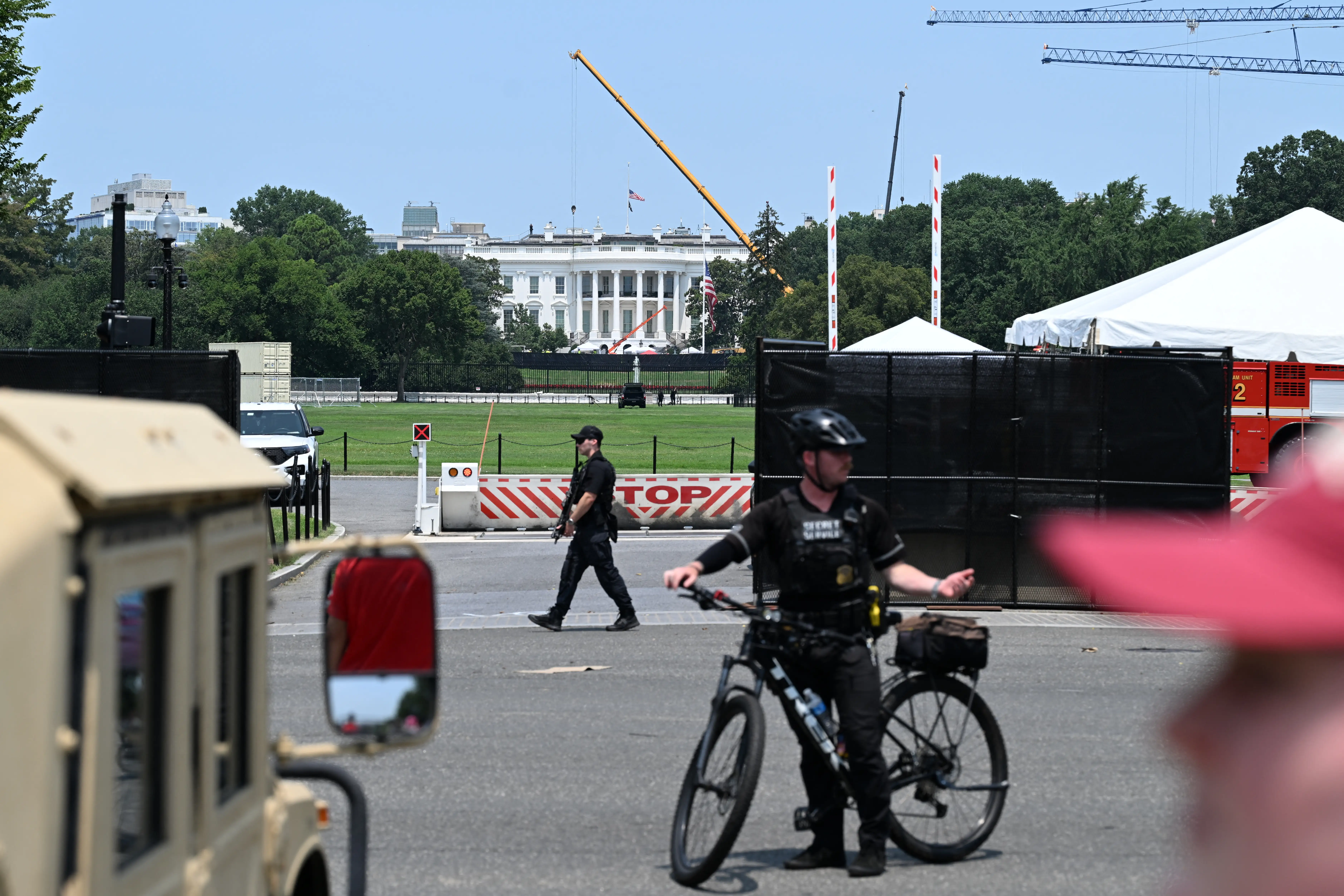 Security patrols outside the White House as construction of a new helipad continues in Washington, DC, on July 15, 2026.