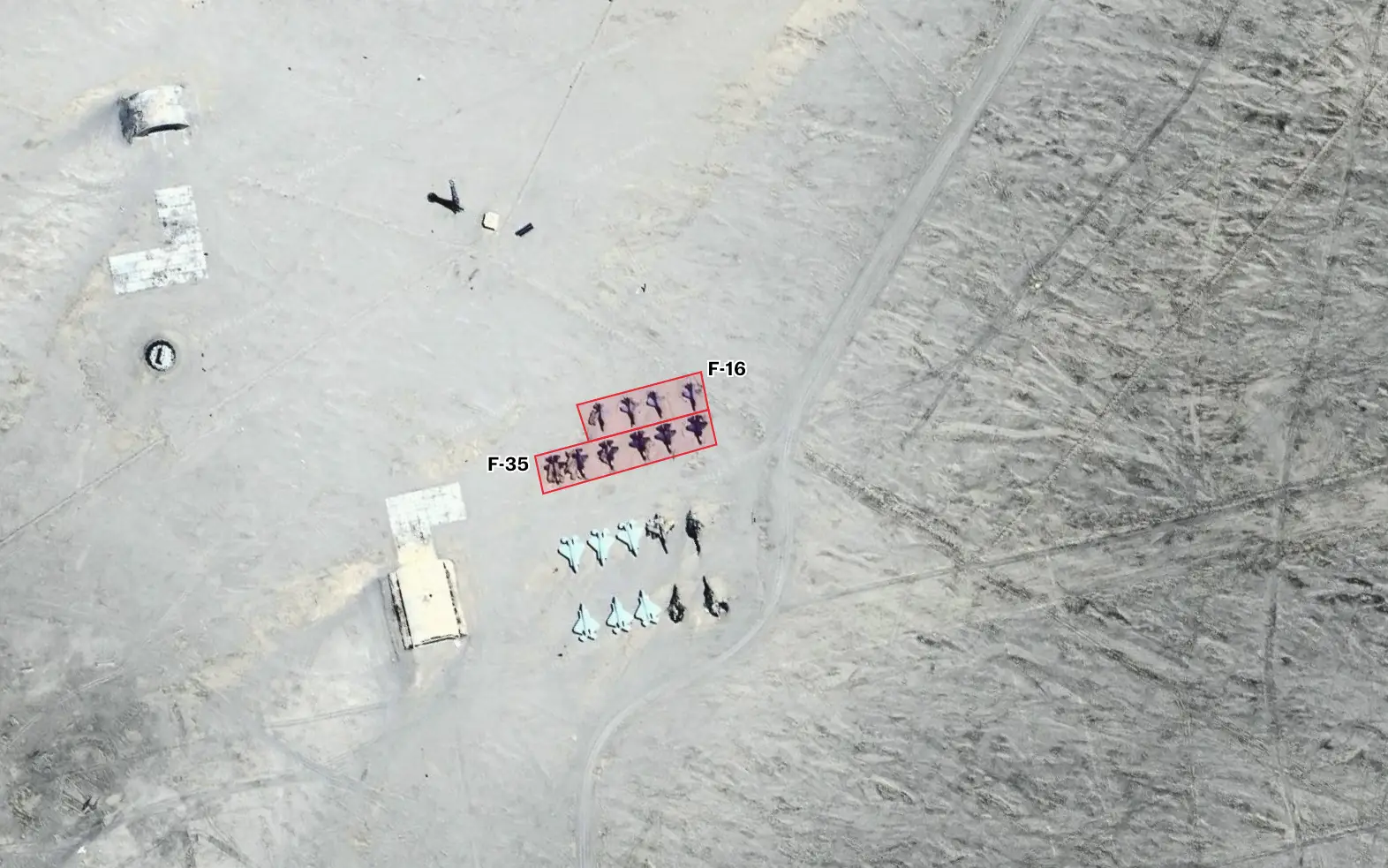 A mock runway in China has replicas of F-35 and F-16 fighter jets, as well as two rows of F-22s nearby.
