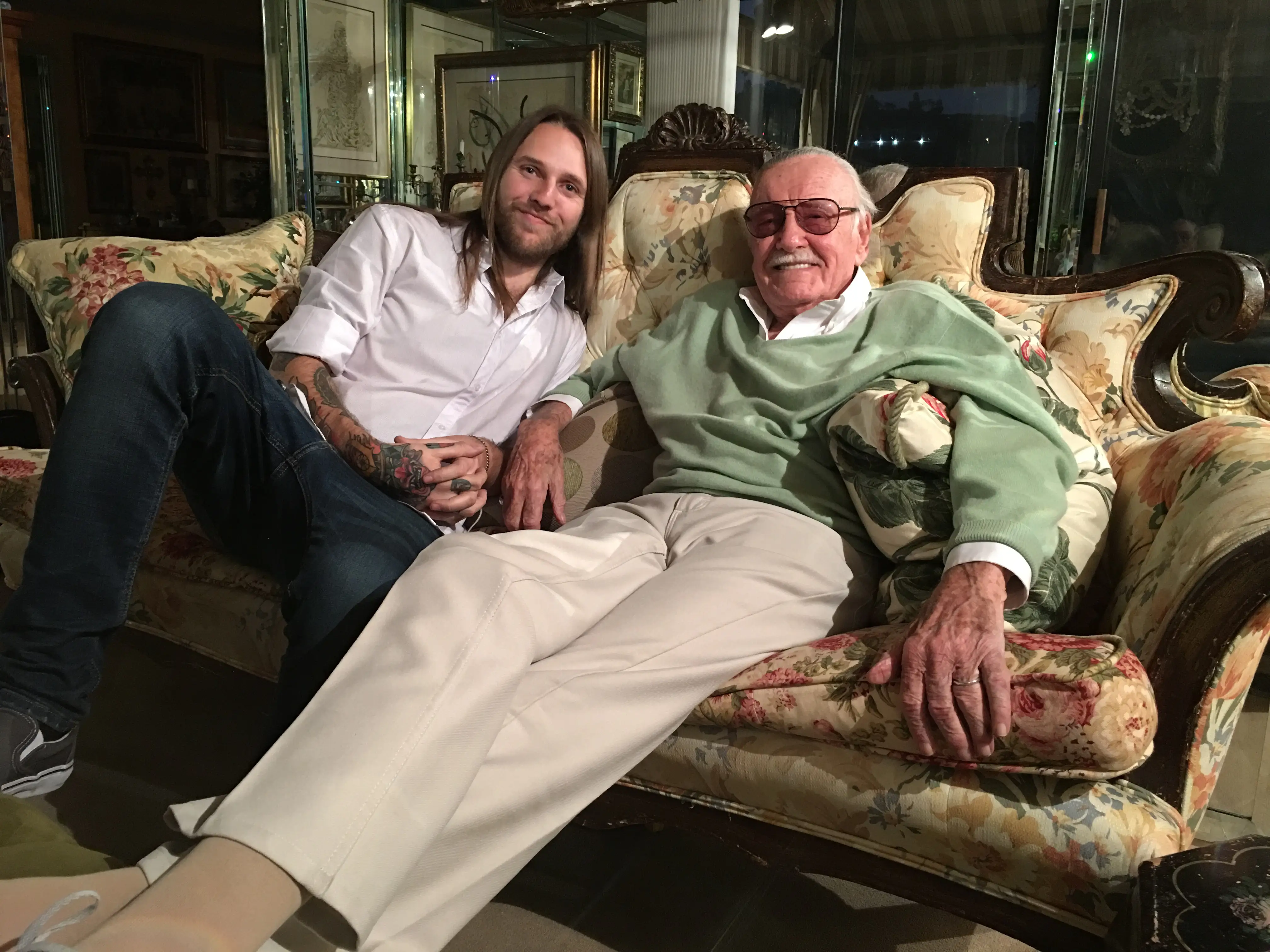 Jon Bolerjack and Stan Lee sitting on a couch
