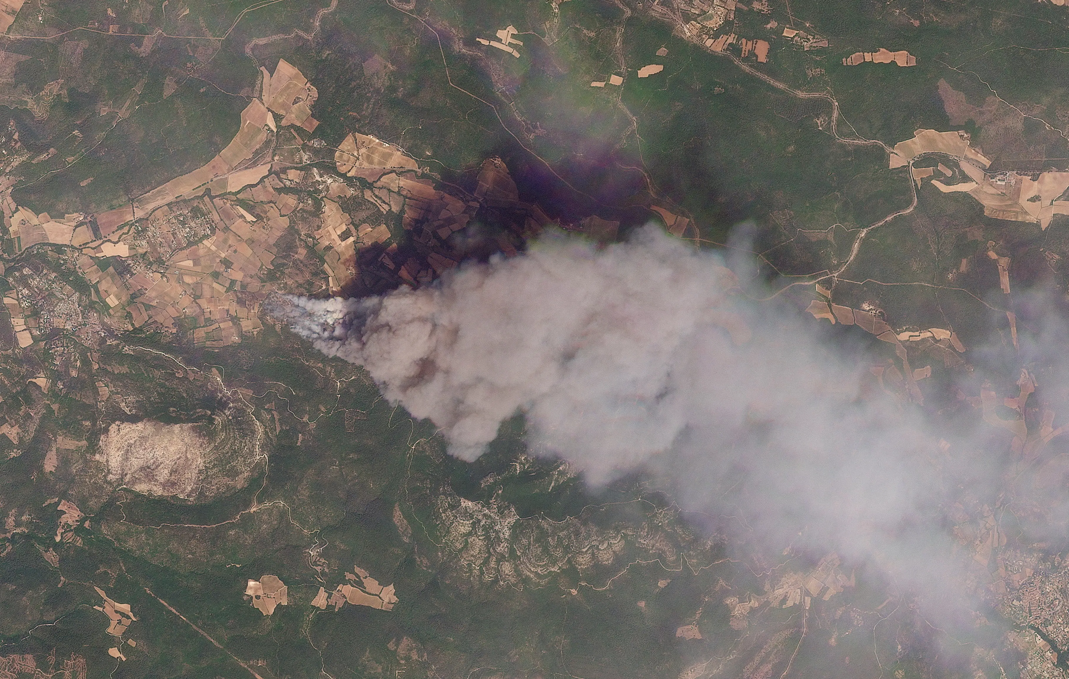 Satellite imagery shows smoke rising from a wildfire in an area in Ponteves, France July 21, 2026.