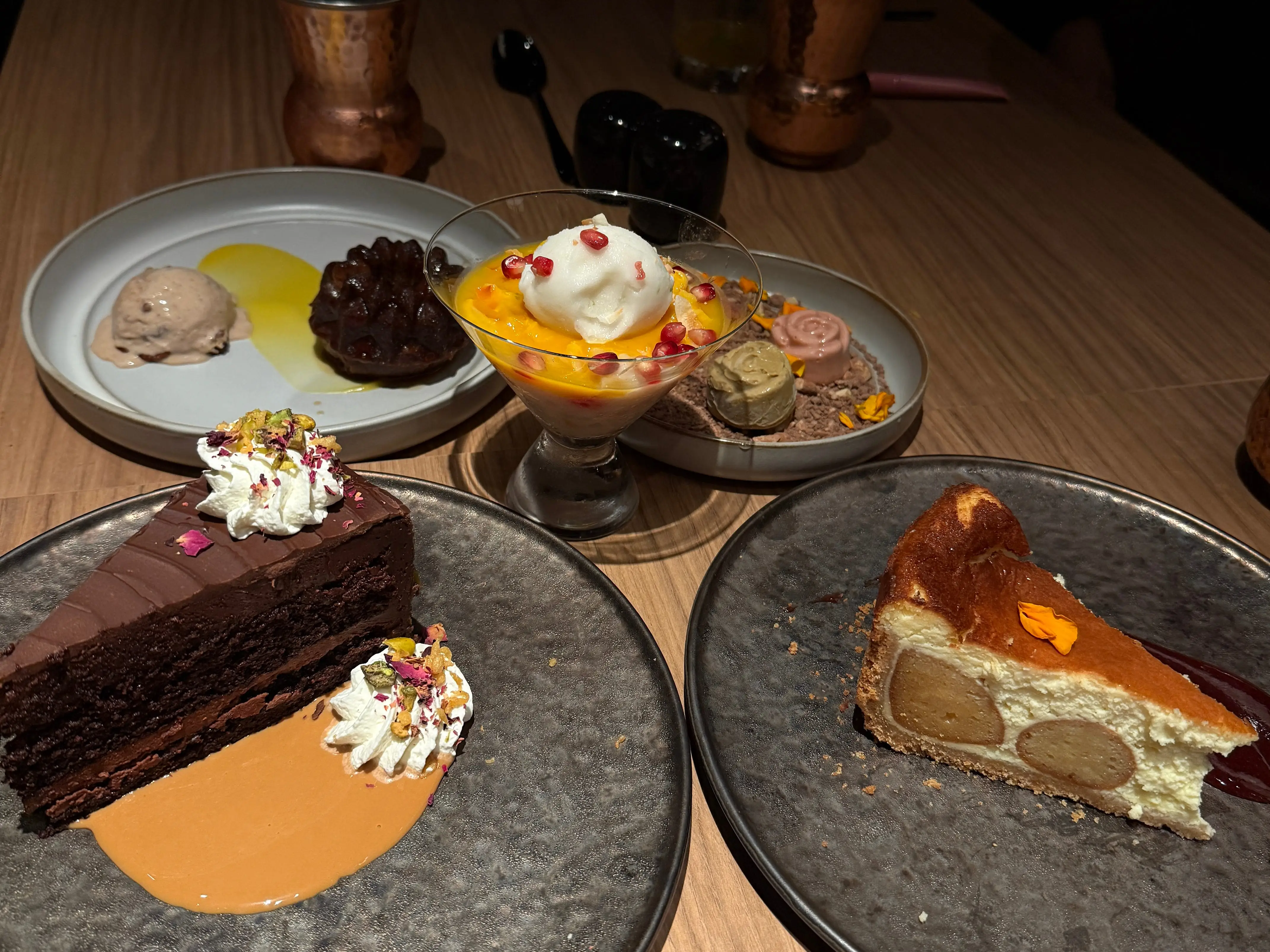 A variety of desserts at an Indian restaurant aboard a Virgin Voyages cruise ship.