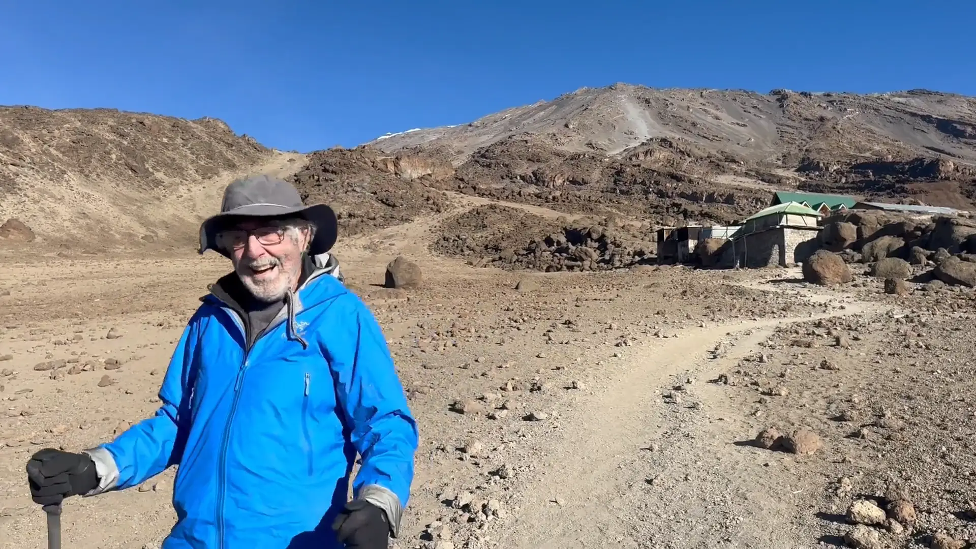 A senior man on a hiking trail on Kilimanjaro.