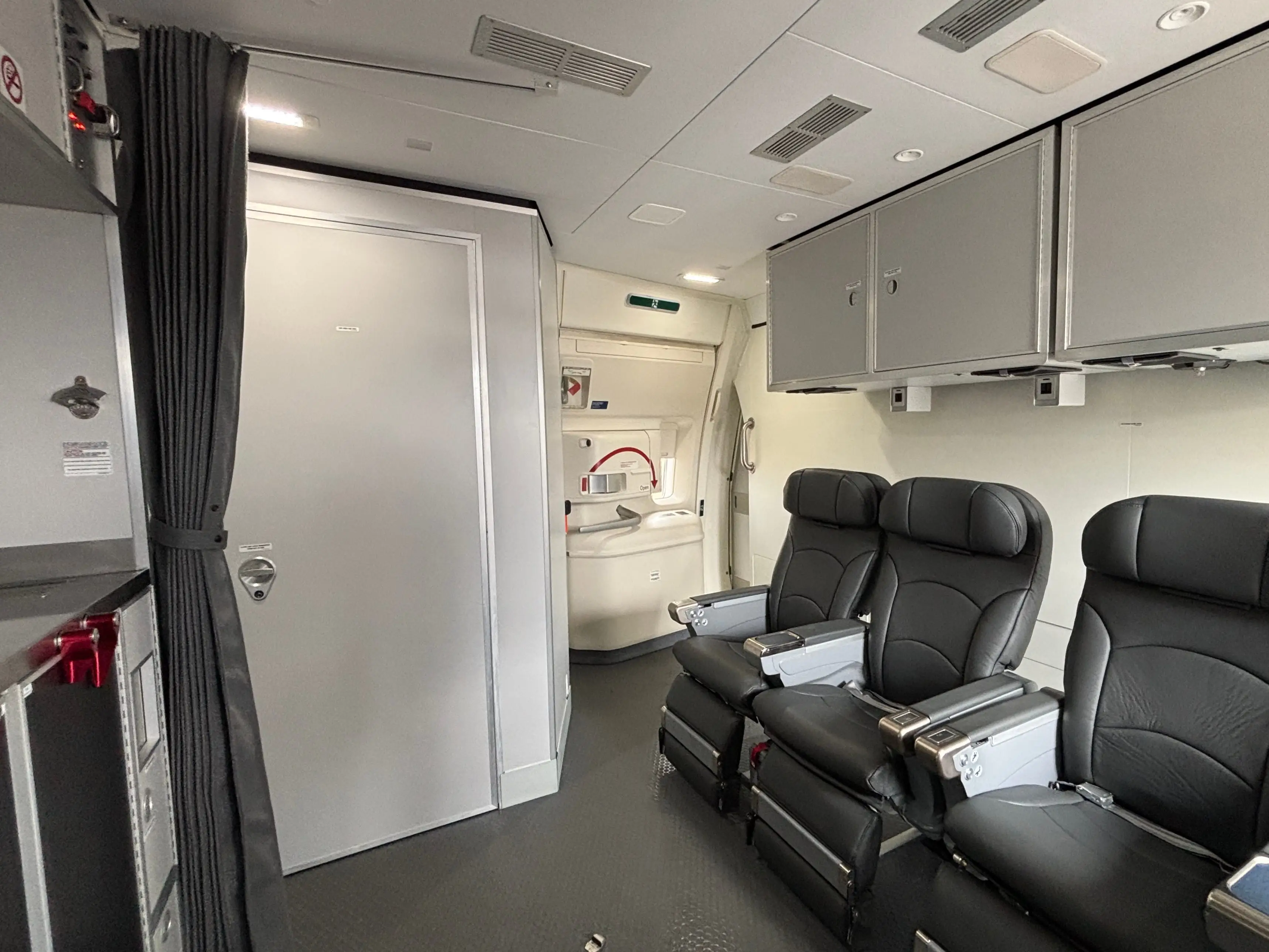 A wide shot of the front crew area on a DHL Boeing 777