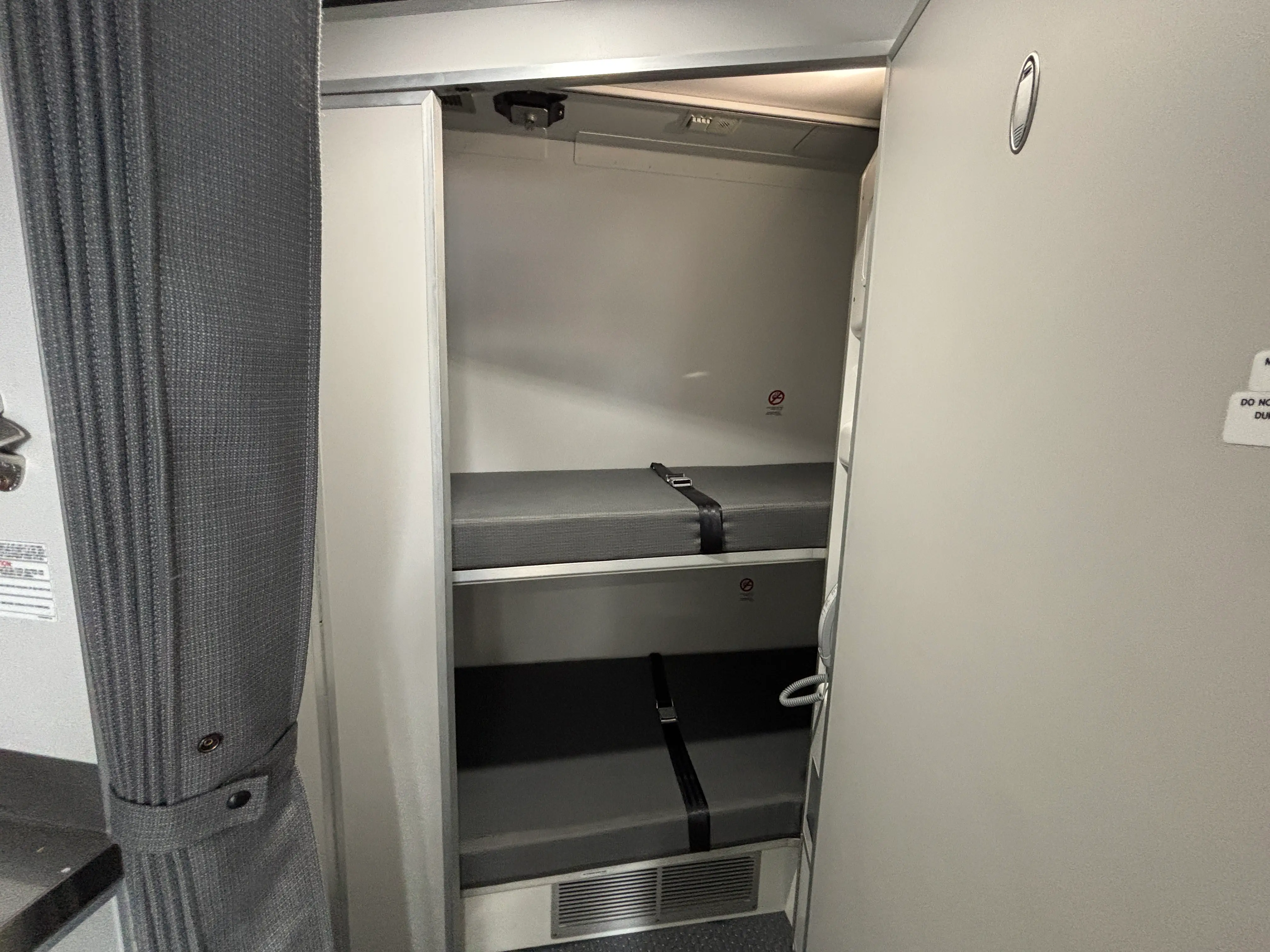 The crew rest area with two small beds inside a DHL Boeing 777