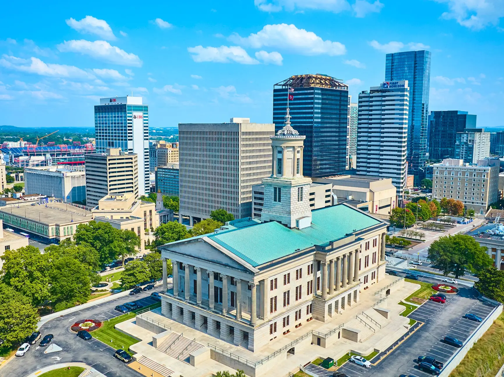 State capitol building next to other buildings in Nashville, Tennessee.