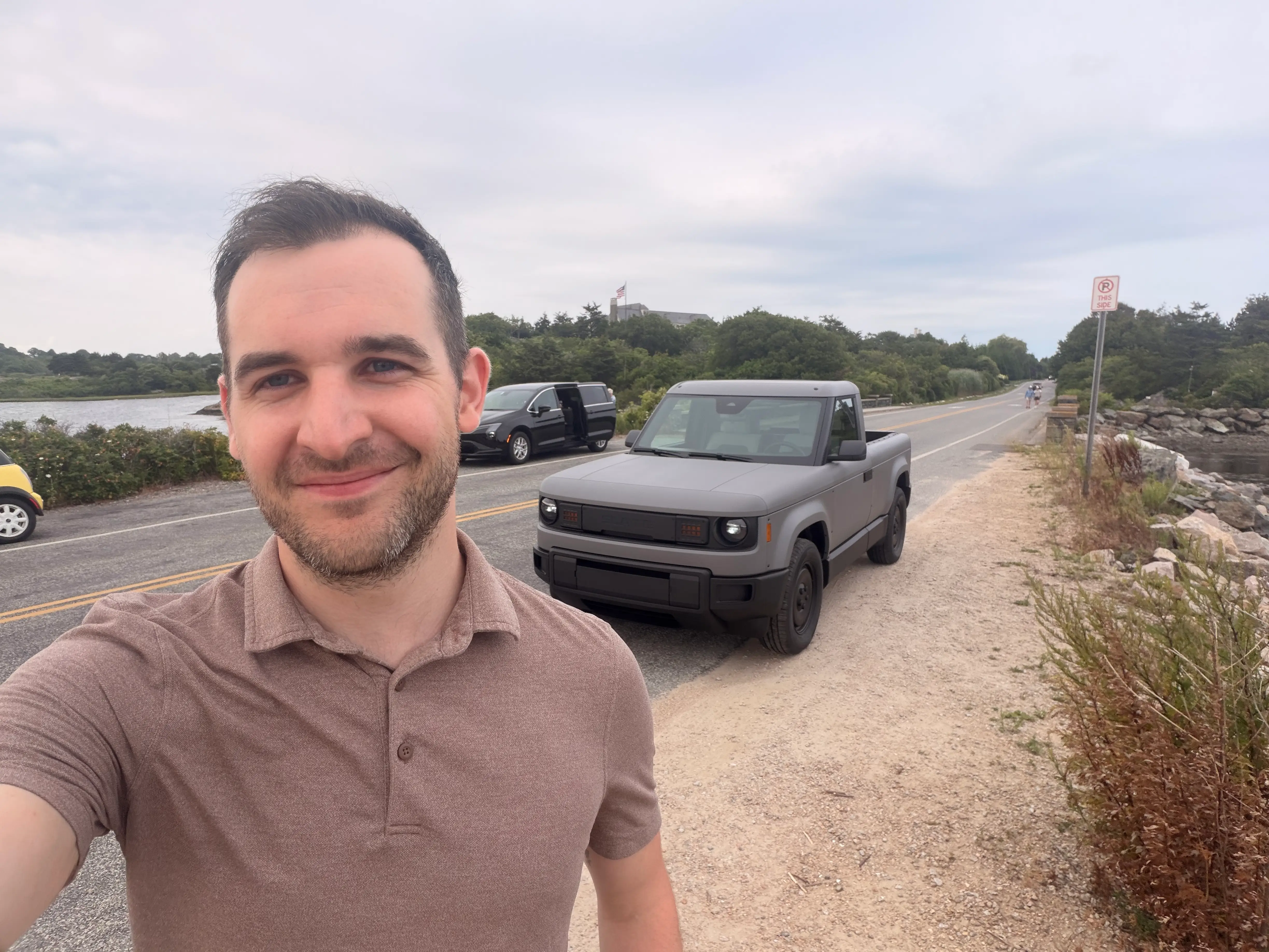 Business Insider reporter Ben Shimkus stands in front of a Slate pickup truck.