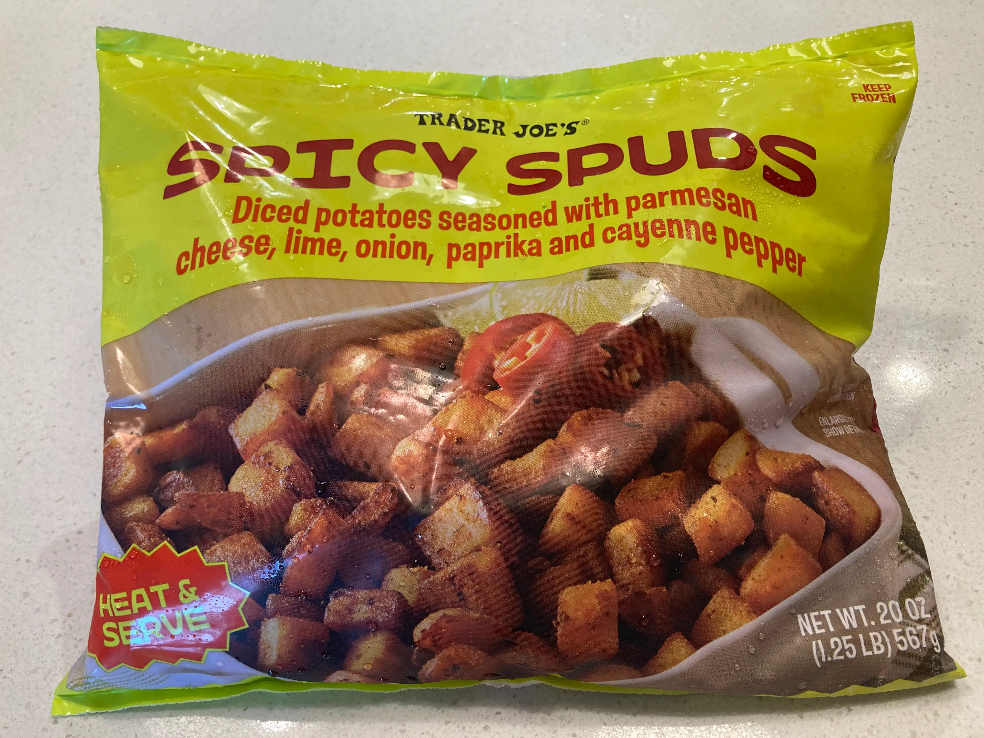 A bag of Trader Joe's Spicy Spuds sitting on a table.