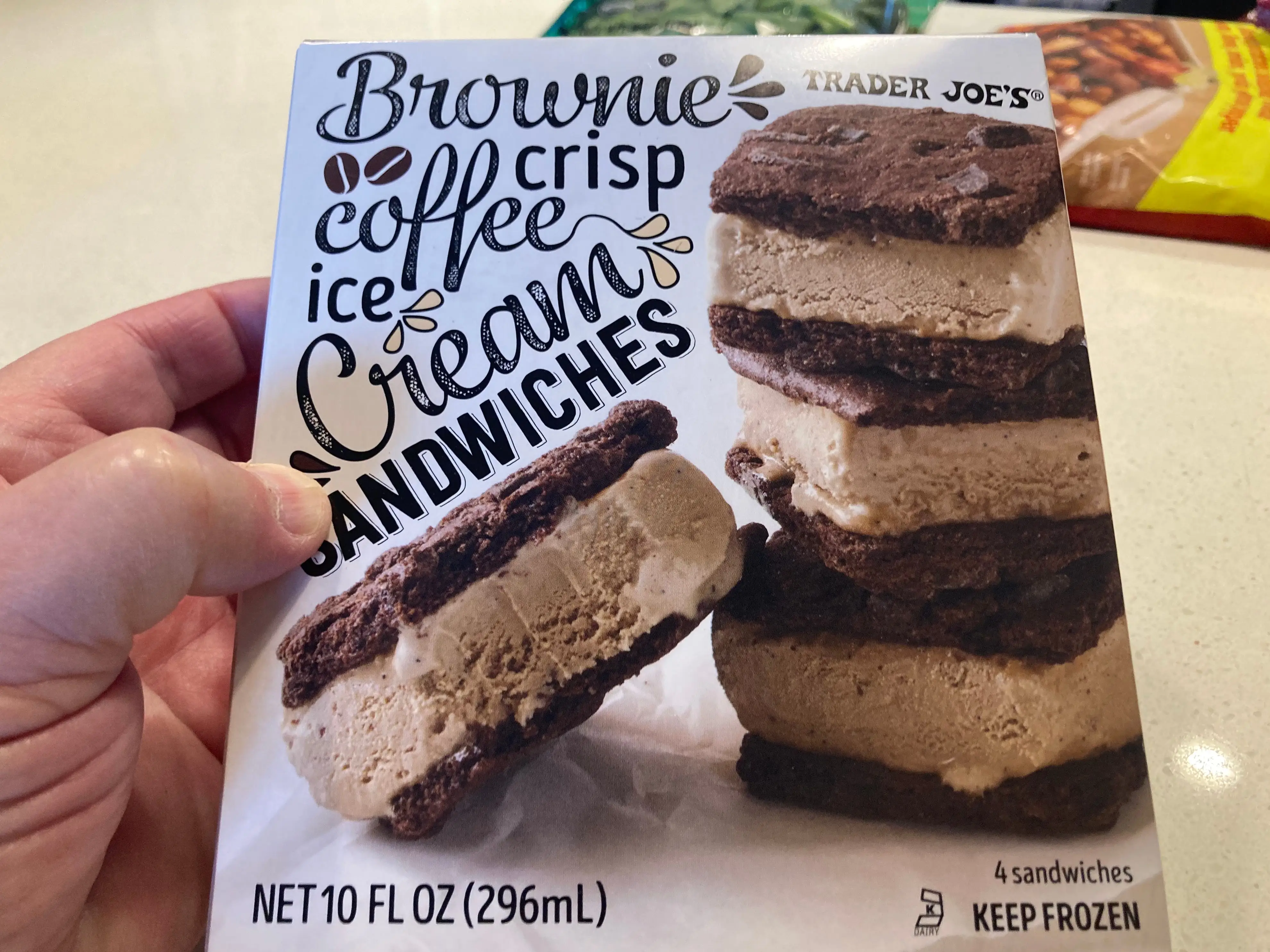 A box of Trader Joe's brownie-crisp coffee-ice-cream sandwiches.