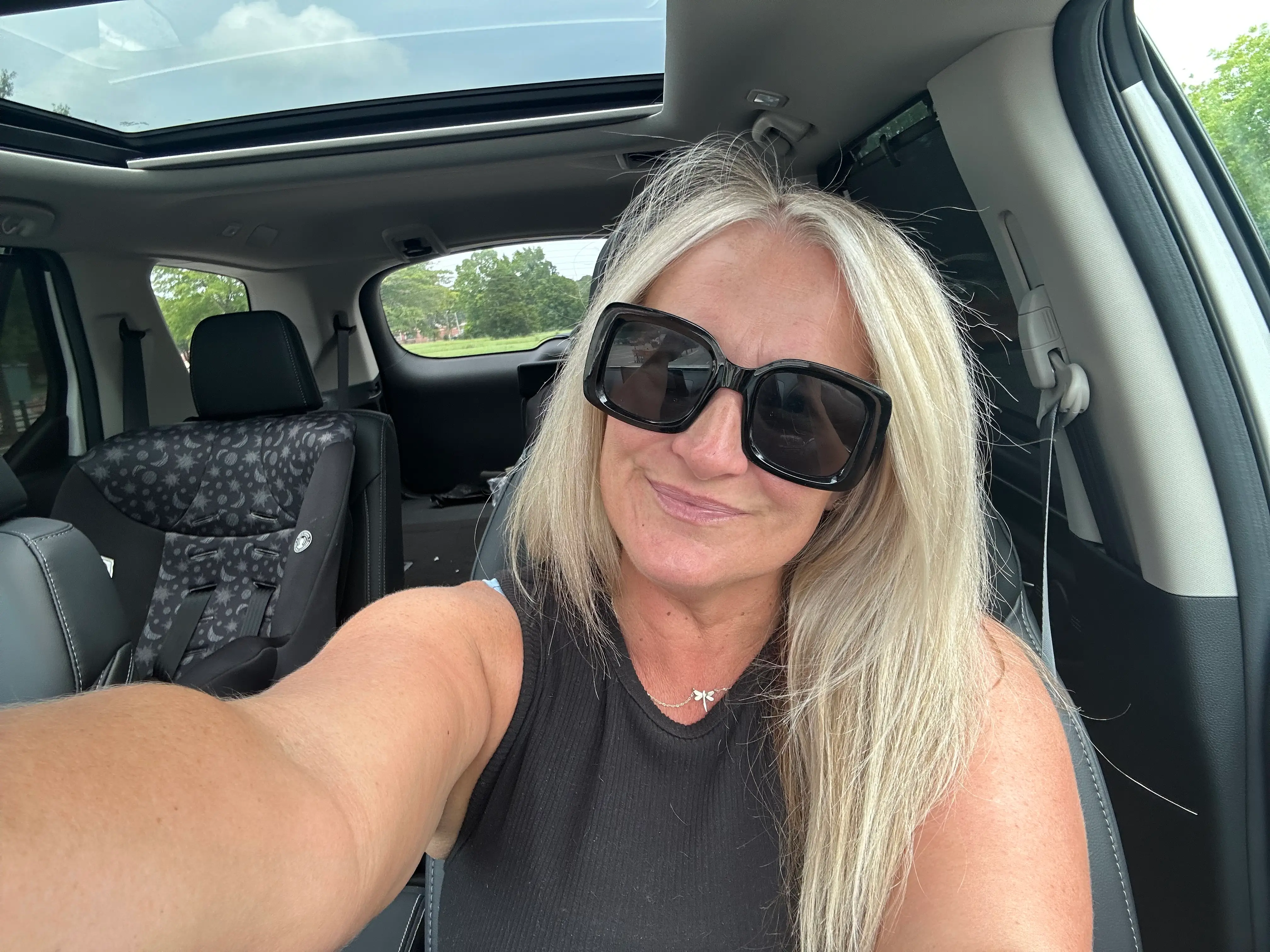 Michelle Pippin, a Honda Pilot owner, sits in the front seat of her car.