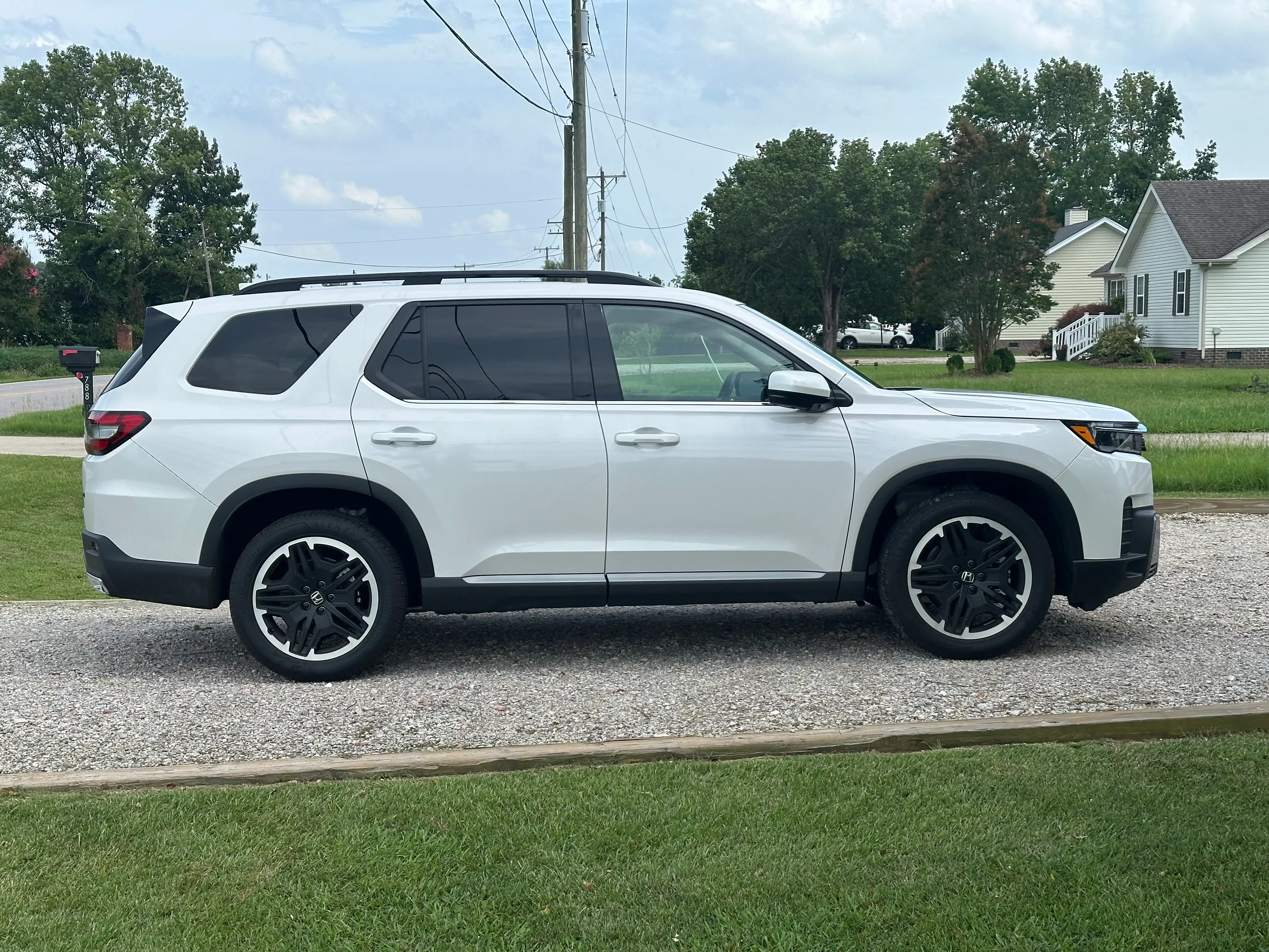 Michelle Pippin's white Honda Pilot is parked in a driveway.
