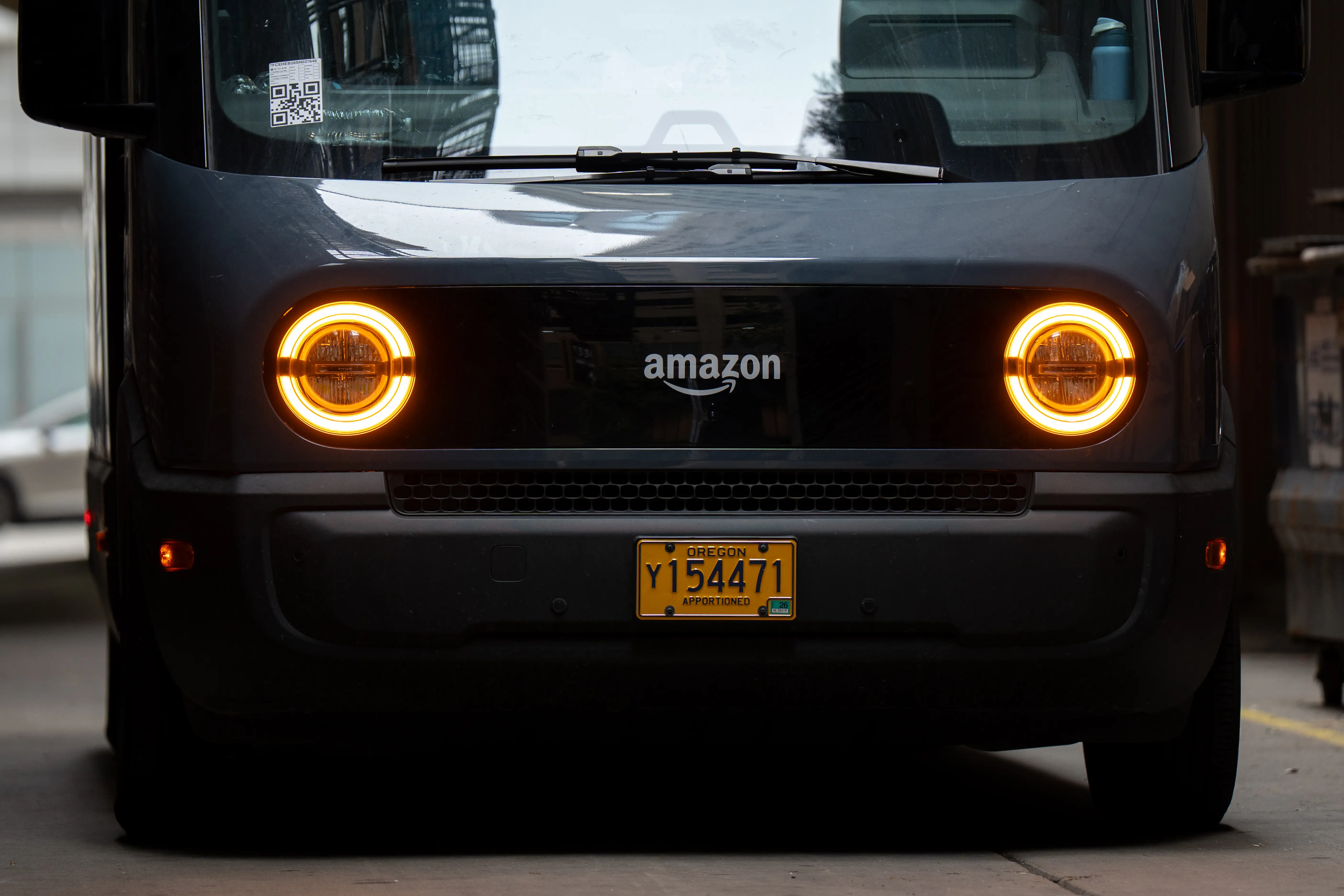 An Amazon electric delivery truck is seen in Chicago, Illinois, United States, on July 25, 2026. The Rivian Electric Delivery Van EDV, custom-built by automaker Rivian, is used by the global e-commerce and logistics company for package delivery. (Photo by Marcin Golba/NurPhoto via Getty Images)