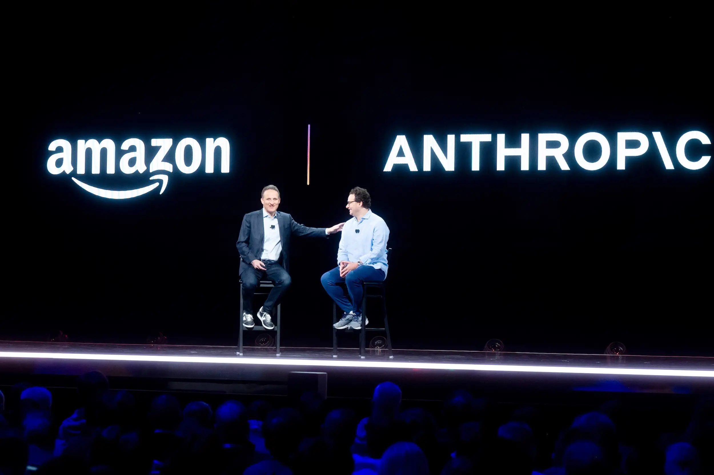 Then-AWS CEO  Adam Selipsky gestures toward Dario Amodei