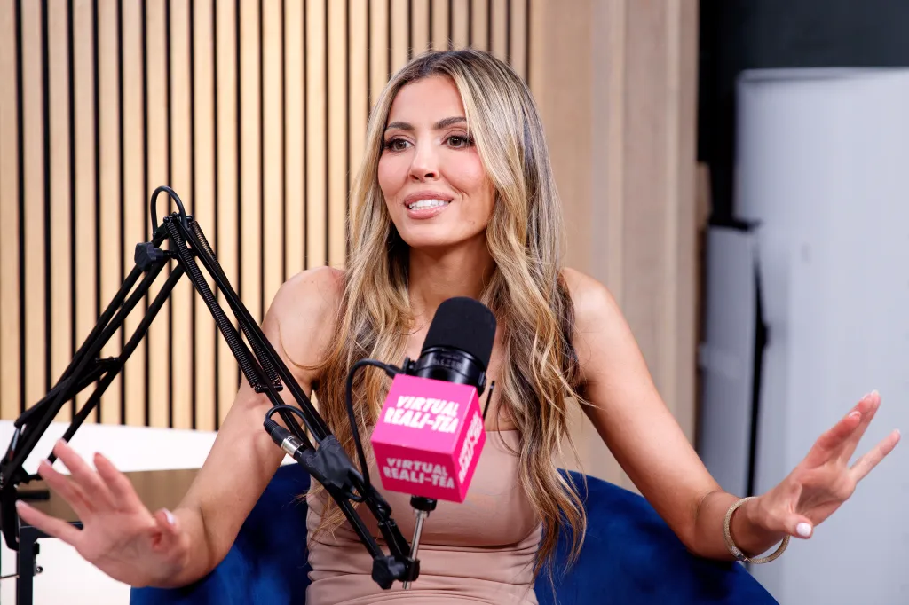 Georgina Ferzli speaking into a microphone with