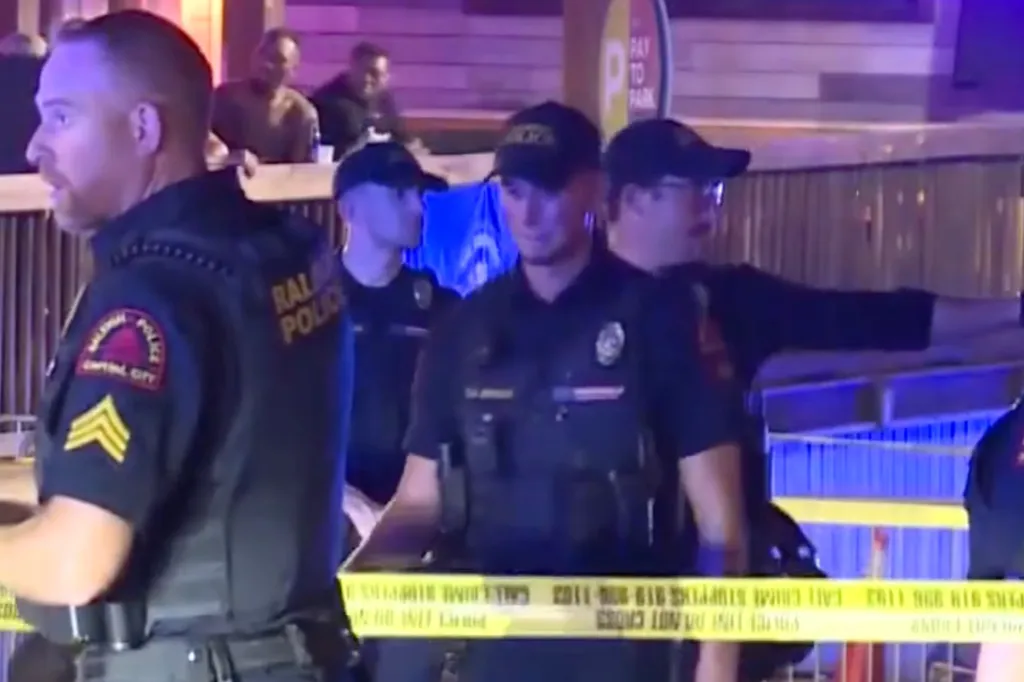 Police investigate the scene after thousands of teens broke out into violence over the July 4 weekend in Raleigh, North Carolina.