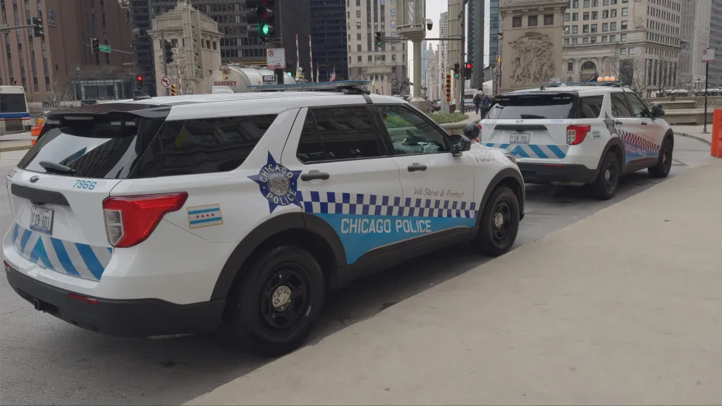 Two Chicago Police Ford Interceptor Utility SUVs parked on Michigan Avenue in downtown Chicago.