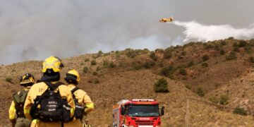 At least 11 people killed as wildfires sweep southern Spain