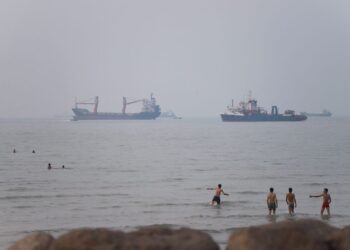 Tanker set on fire after being struck in Strait of Hormuz, British military says