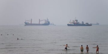 Tanker set on fire after being struck in Strait of Hormuz, British military says