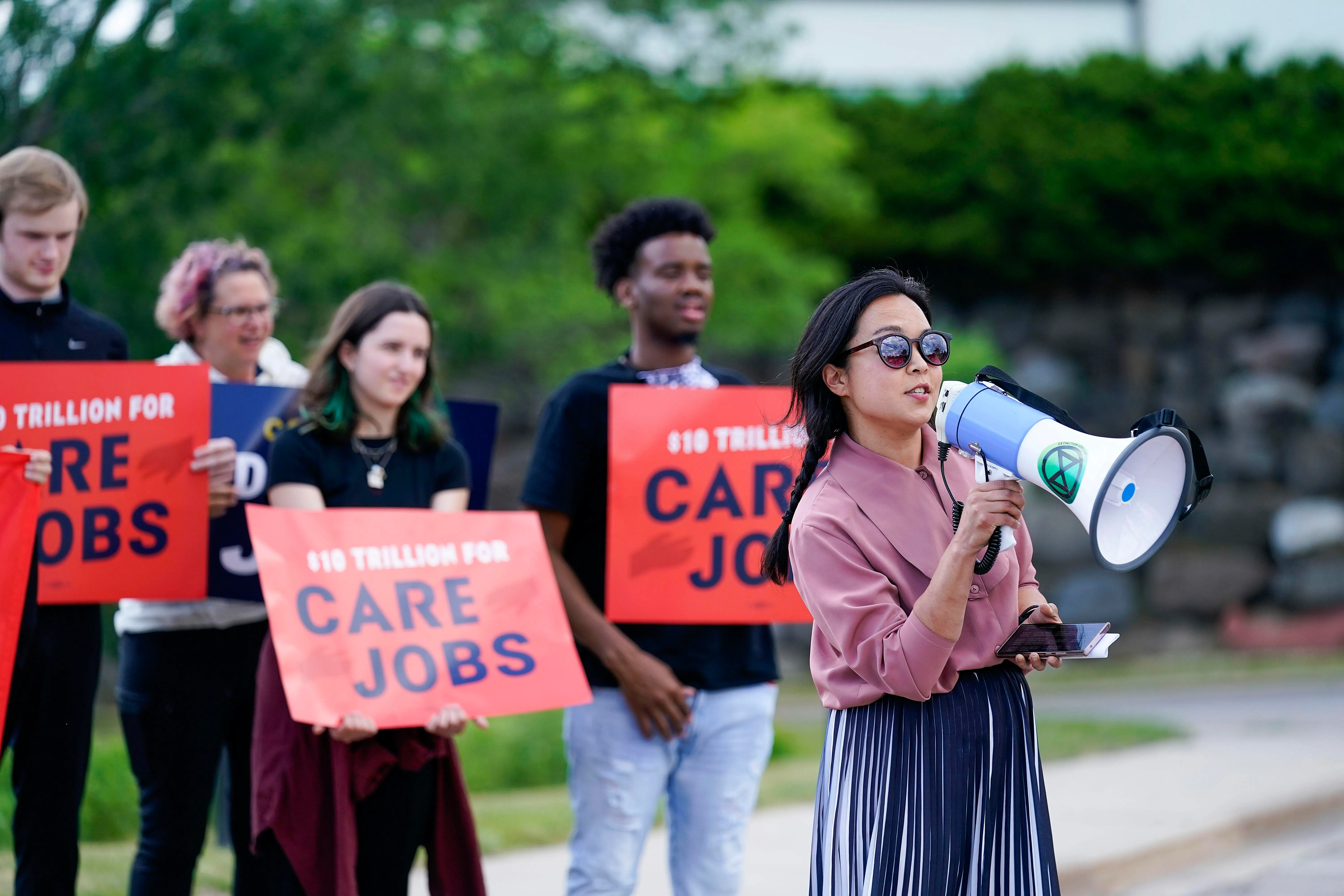 Wisconsin State Rep. Francesca Hong speaks into a megaphone Wisconsin State Rep. Francesca Hong speaks into a megaphone