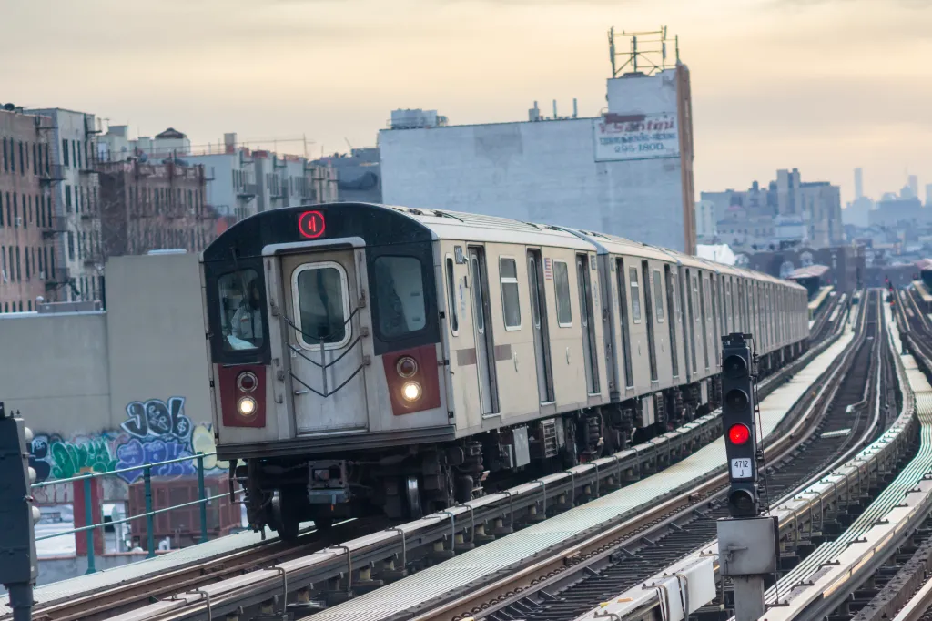A subway train with a red