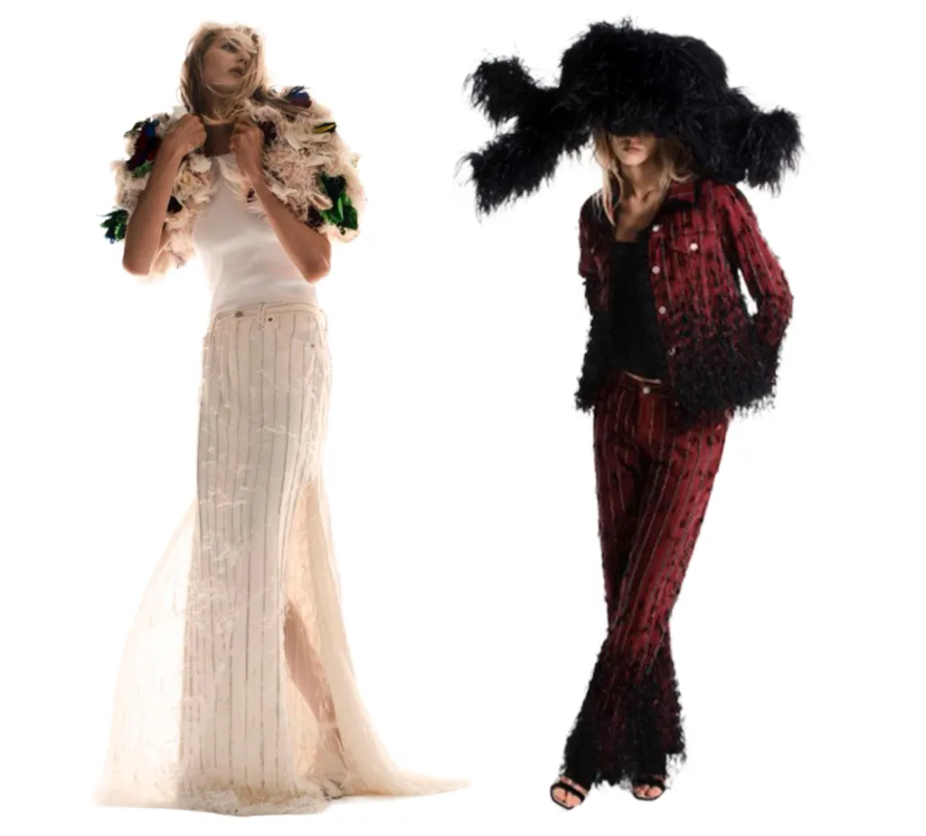 Two models in avant-garde outfits: one in a white top, a long cream skirt, and an ornate, feathered jacket; the other in a black top, red-and-black feathered jacket and pants, and a large, black feathered hat.