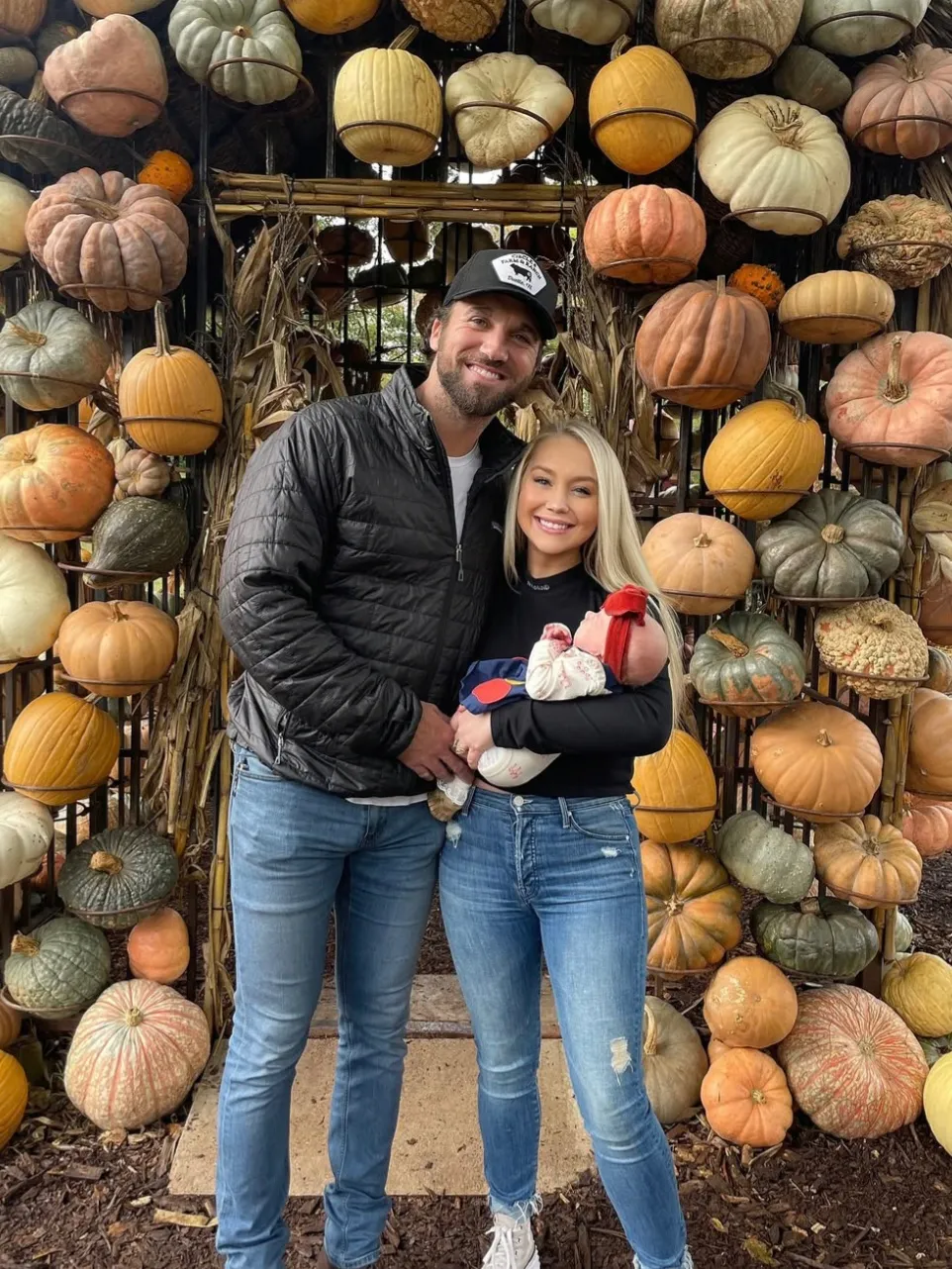 The couple pose with their daughter, Daisy, in an undated photo shared on Instagram. 