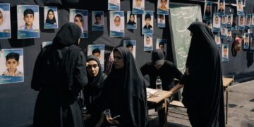 Families of children killed in bombing of Iranian school join leader’s funeral