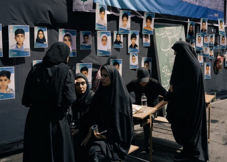 Families of children killed in bombing of Iranian school join leader’s funeral