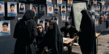 Families of children killed in strike on Iranian school join leader’s funeral