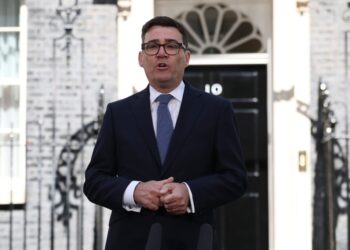 A U.K. prime minister takes charge with a promise to dilute power