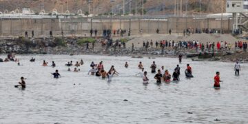 Migrants overrun a Spanish outpost, stirring White House outrage