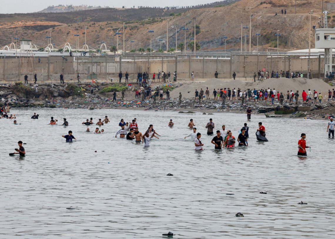 Migrants overrun a Spanish outpost, stirring European outrage