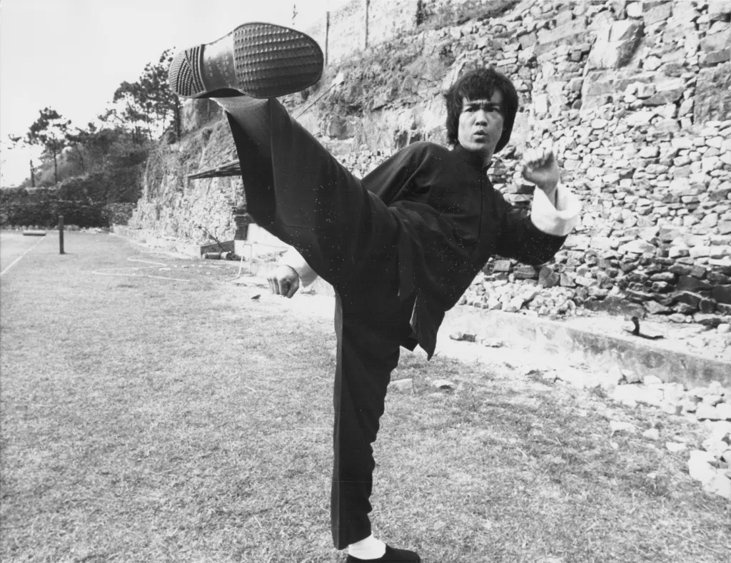 Bruce Lee performing a high kick on the set of 