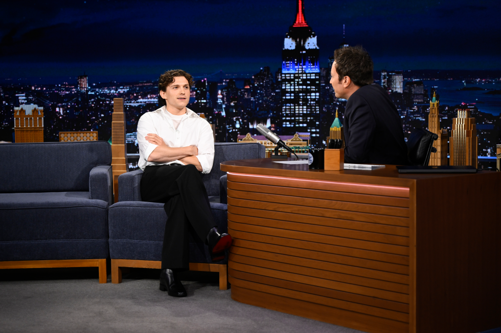 Actor Tom Holland being interviewed by host Jimmy Fallon on 