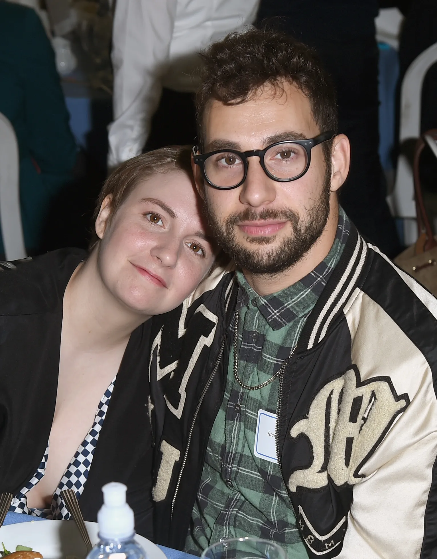 Lena Dunham rests her head on Jack Antonoff's shoulder.