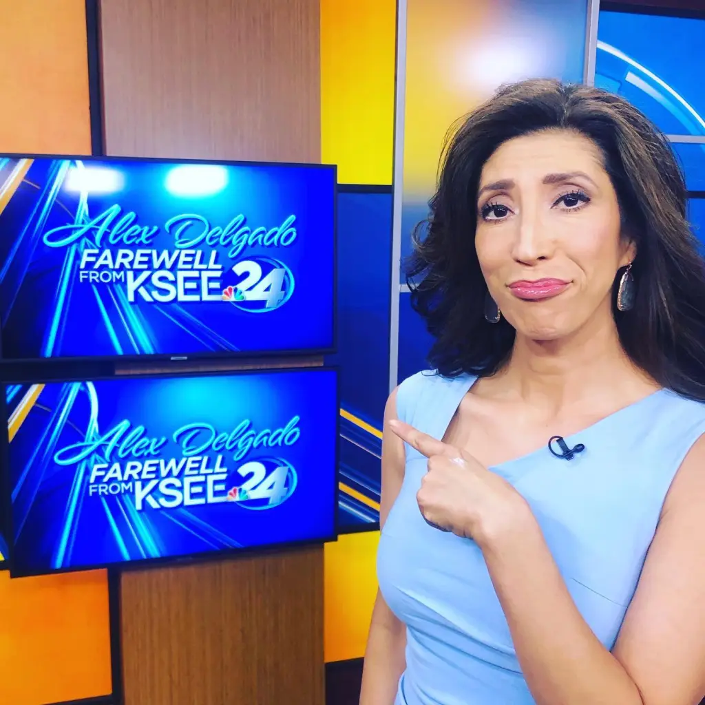 Alex Delgado pointing to a screen displaying