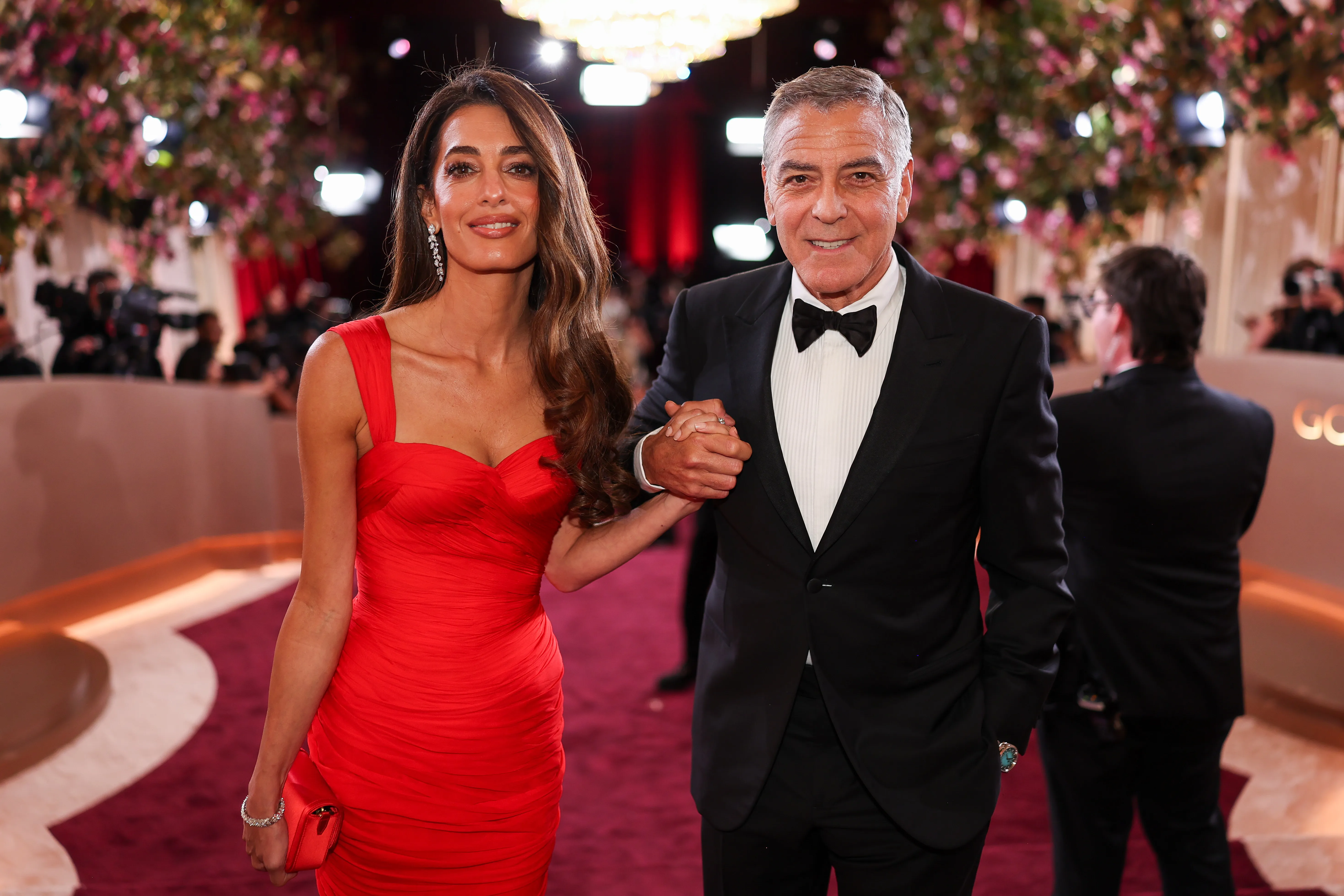 Amal Clooney and George Clooney on the red carpet at the 83rd Annual Golden Globes