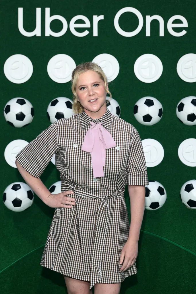 Amy Schumer smiling at 
