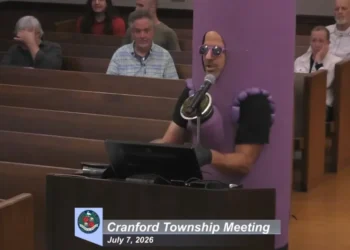 Chaos as singing protesters take over town council meeting in blue district