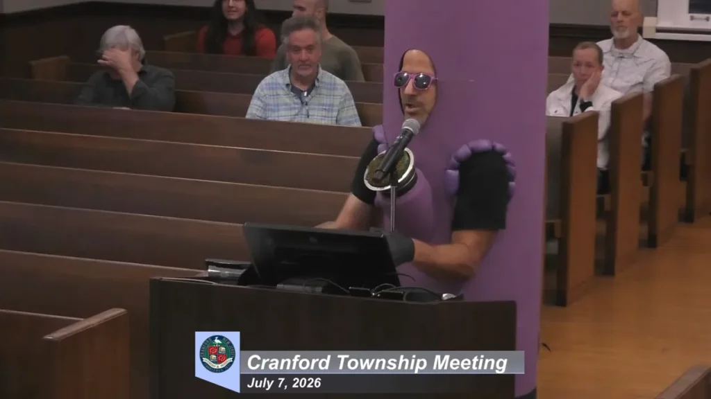 Chaos as singing protesters take over town council meeting in blue district