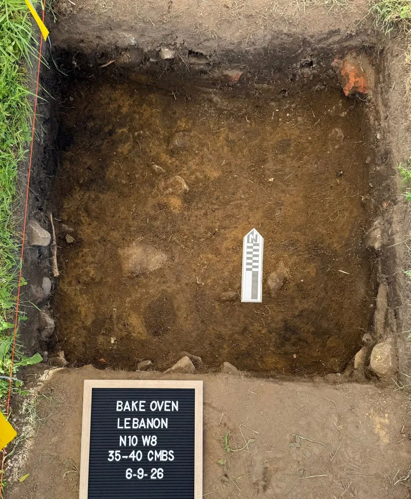 Archaeological excavation pit showing a partially unearthed bake oven in Lebanon, Connecticut.