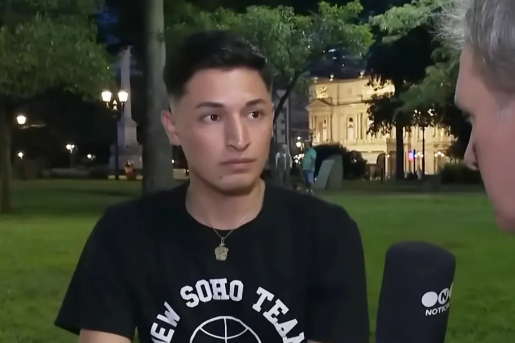 Braian Paiz being interviewed in a park at night.