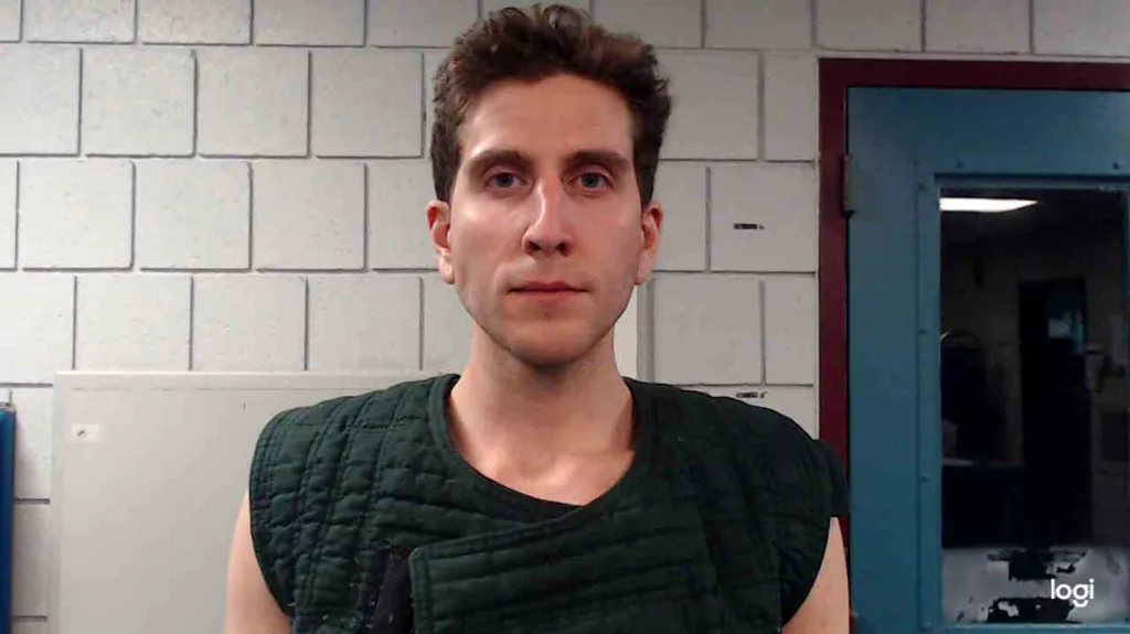 Booking photo of Bryan Christopher Kohberger, 28, wearing a dark green quilted vest.
