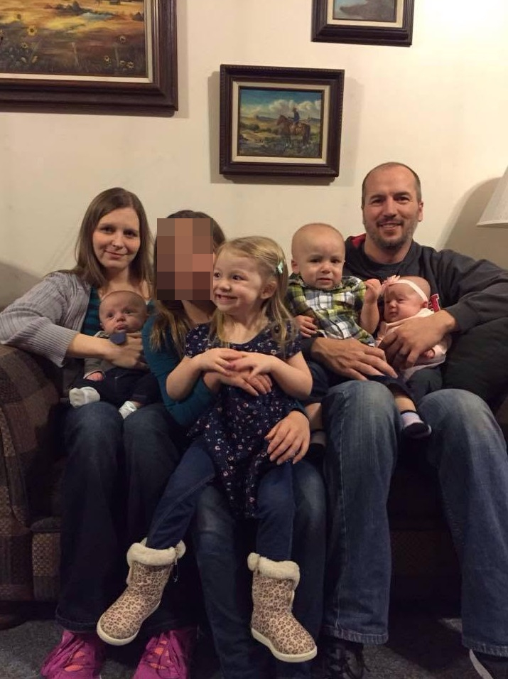 Brady Harmon is seen with his four children.